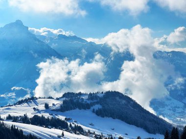Beautiful low winter clouds and fog condensation in the Swiss Alps during a polar cold snap, Amden - Canton of St. Gallen, Switzerland / Schweiz
