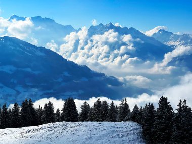 Beautiful low winter clouds and fog condensation in the Swiss Alps during a polar cold snap, Amden - Canton of St. Gallen, Switzerland / Schweiz