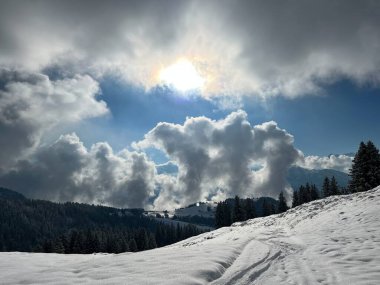 Beautiful low winter clouds and fog condensation in the Swiss Alps during a polar cold snap, Amden - Canton of St. Gallen, Switzerland / Schweiz