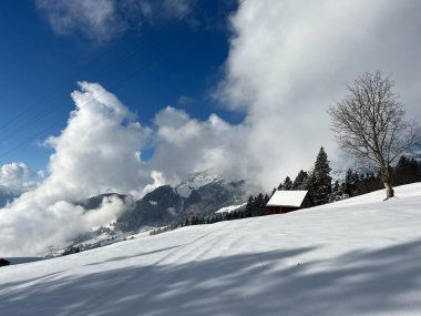 Beautiful low winter clouds and fog condensation in the Swiss Alps during a polar cold snap, Amden - Canton of St. Gallen, Switzerland / Schweiz