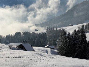 Beautiful low winter clouds and fog condensation in the Swiss Alps during a polar cold snap, Amden - Canton of St. Gallen, Switzerland / Schweiz