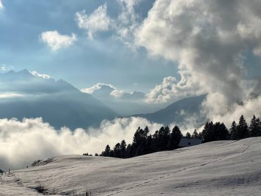 Beautiful low winter clouds and fog condensation in the Swiss Alps during a polar cold snap, Amden - Canton of St. Gallen, Switzerland / Schweiz