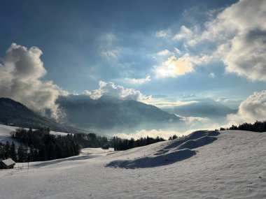 Beautiful low winter clouds and fog condensation in the Swiss Alps during a polar cold snap, Amden - Canton of St. Gallen, Switzerland / Schweiz