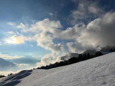 Beautiful low winter clouds and fog condensation in the Swiss Alps during a polar cold snap, Amden - Canton of St. Gallen, Switzerland / Schweiz