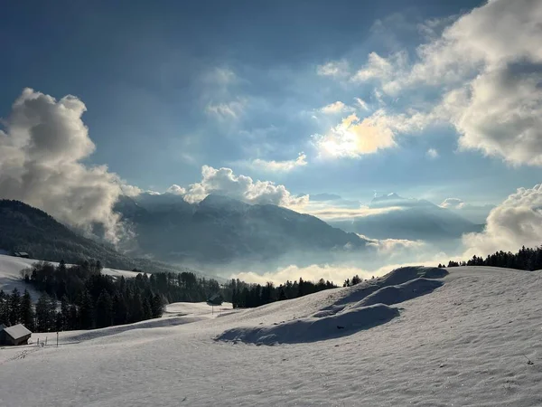 Beautiful low winter clouds and fog condensation in the Swiss Alps during a polar cold snap, Amden - Canton of St. Gallen, Switzerland / Schweiz