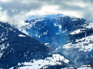 Beautiful low winter clouds and fog condensation in the Swiss Alps above the tourist resorts of Valbella and Lenzerheide in the Swiss Alps - Canton of Grisons, Switzerland (Schweiz)