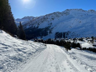 Excellently arranged and cleaned winter trails for walking, hiking, sports and recreation in the area of the Swiss tourist winter resort of Arosa - Canton of Grisons, Switzerland (Schweiz)