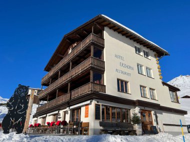 Swiss alpine holiday homes, mountain villas and holiday apartments in the winter ambience of the Swiss tourist winter resort of Arosa - Canton of Grisons, Switzerland (Schweiz)