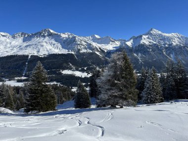 A fairytale winter atmosphere and a magnificent panorama on the mountine tourist resorts of Valbella and Lenzerheide in the Swiss Alps - Canton of Grisons, Switzerland (Schweiz)