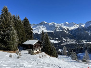 A fairytale winter atmosphere and a magnificent panorama on the mountine tourist resorts of Valbella and Lenzerheide in the Swiss Alps - Canton of Grisons, Switzerland (Schweiz)