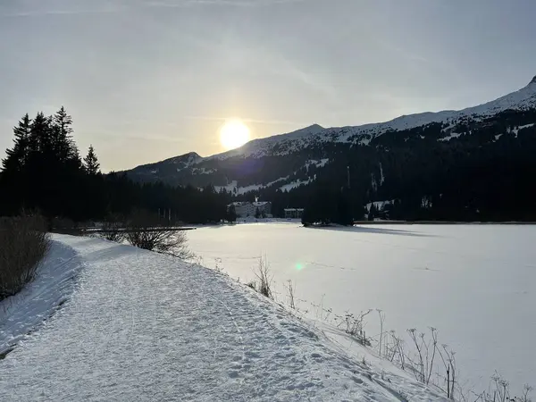 stock image A typical winter idyll on the frozen and snow-covered alpine lake Heidsee (Igl Lai See) in the Swiss winter resorts of Valbella and Lenzerheide - Canton of Grisons, Switzerland / Schweiz