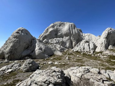 Rocky ridge of Tulove grede or karst mountain peak of Tulovice - Velebit Nature Park, Croatia (Stjenoviti greben Tulove grede ili krski planinski vrh Tulovice - Park prirode Velebit, Hrvatska)