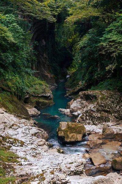 stock image Beautiful natural canyon with view of the mountain river, christal blue water, green tree, Summer day time. Travel and active life style. Vacation. Martvili in Georgia near Kutaisi. Vertical photo