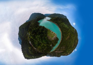 Aerial little planet view Inguri reservoir lake in Upper Svaneti region, Georgia. Summer day, Emerland water. The mountains are covered with coniferous forests. Travel and tourism