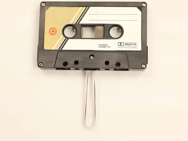 Close-up from above of a vintage black stereo cassette tape.