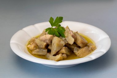 Olive oil artichoke dish cooked with lamb meat