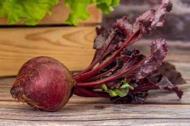 Red beets on wooden table