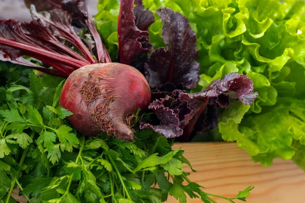 Red beets on wooden table