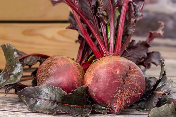 Red beets on wooden table