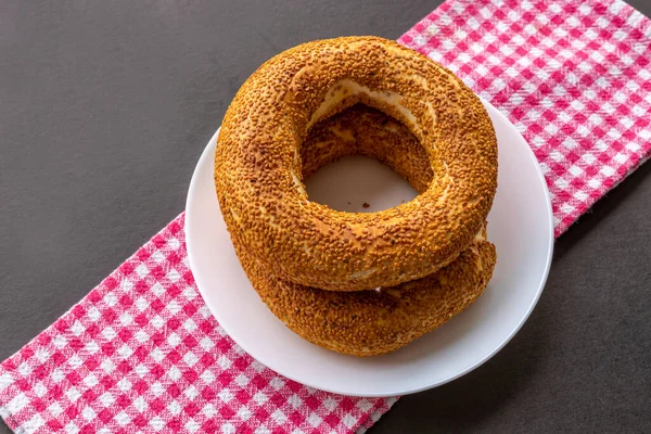 Turkish fast food bagel called Simit. Turkish bagel Simit with sesame. Bagel is traditional Turkish bakery food.