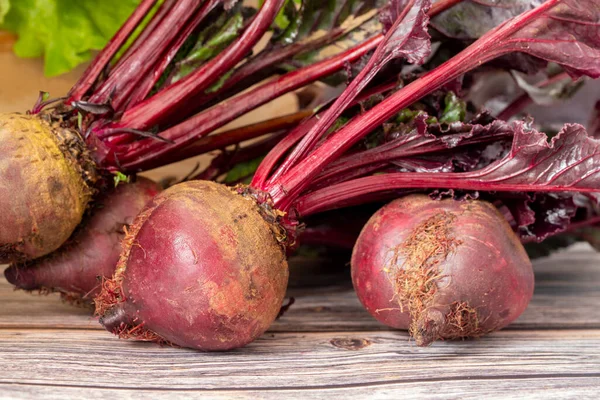 Red beets on wooden table