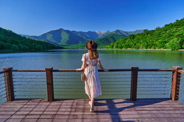 Traveler Girl Standing Alone Edge Pier Staring Lake Mountains Enjoying Stock Photo