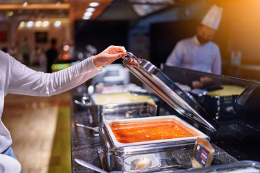 Catering buffet food with heated trays in hotel all inclusive service