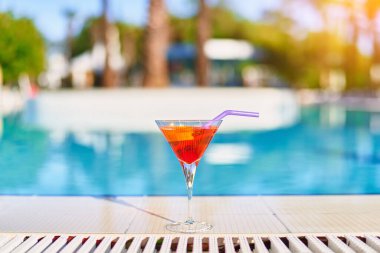 Relaxing vacations with refreshing aperol cocktail by the pool at the all-inclusive resort 