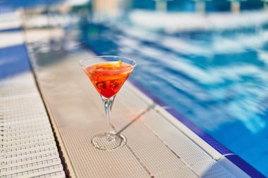 Relaxing vacations with refreshing aperol cocktail by the pool at the all-inclusive resort 