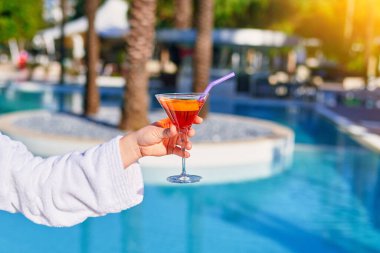 Relaxing vacations with refreshing aperol cocktail by the pool at the all-inclusive resort  clipart