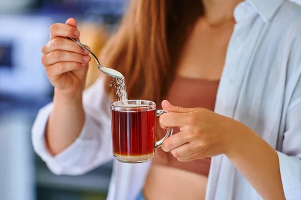Female Hands Pouring Sugar Spoon Glass Cup Hot Black Tea — Stock Photo, Image