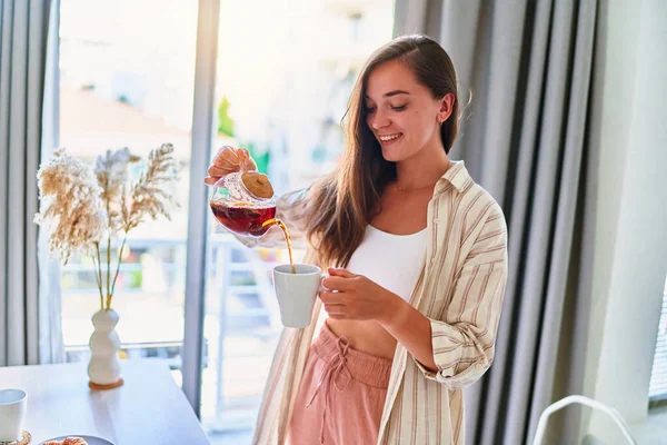 Happy Young Cute Joyful Smiling Satisfied Woman Pouring Hot Tea — Stock Photo, Image
