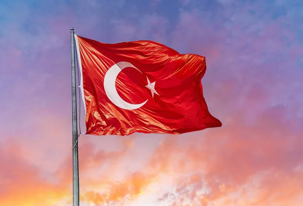 Waving Turkish flag against the sky