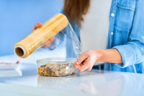 Person Packing Food Using Food Film — Stock Photo, Image