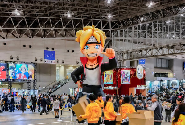 chiba, japan - dec 22 2018: Huge inflatable structure featuring the ninja character Boruto or Bolt Uzumaki from the anime and manga serie Naruto overlooking tourists visiting convention Jump Festa.