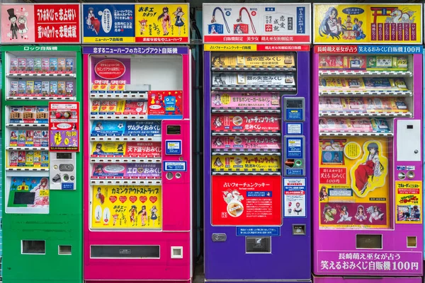 stock image nagasaki, kyushu - dec 14 2022: Colorful full-line vending machines selling funny gags Japanese omikuji lucky charms and fortune cookies wishing marriage and love to transsexuals, balds or fetishists