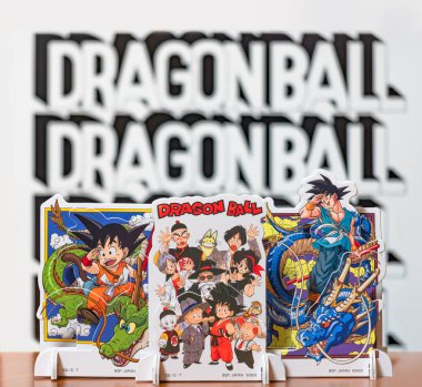 japan, tokyo - mar 8 2024: Mini layer stands representing the characters of the manga, anime and video game franchise Dragon Ball waving goodbye with their hands for the late master Akira Toriyama. clipart