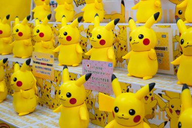 tokyo, akihabara - dec 25 2024: Display of numerous Takara Tomy Hi! Touch Pikachu interactive toys, featuring the character of the iconic Japanese Pokemon game and anime showcased as perfect souvenir. clipart