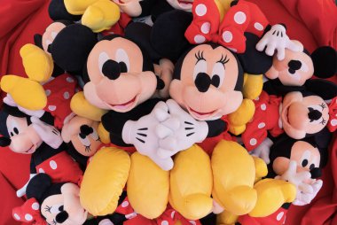 tokyo, ikebukuro - apr 16 2025: A bunch of Japanese Mickey Mouse and Minnie Mouse plush toys with various sizes showcasing popular Disney characters in a colorful and playful manner.