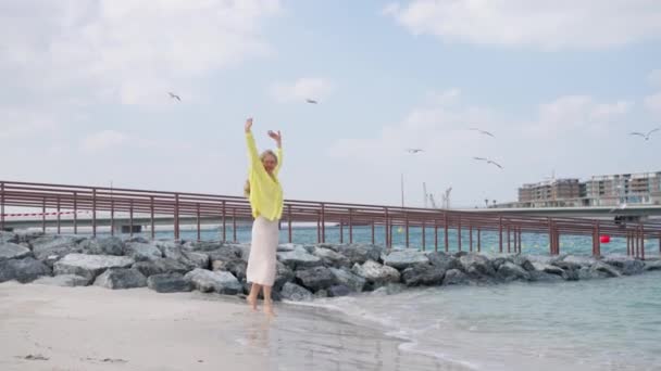 European Woman Tourist Joyfully Jumping Ocean Beautiful Beach Dubai Slow — стоковое видео