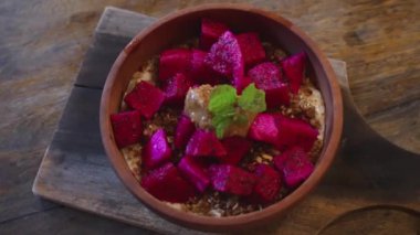 A wholesome breakfast of ripe fruits in coconut shell plates, nutrition to fill you with energy for the whole day, a boost of vitamins from natural organic fruits. Useful detox food for the body