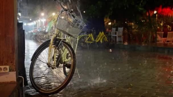 Heavy Downpour Bicycle Parking Night Yellow Bicycle Stands Rain Street — Stock Video