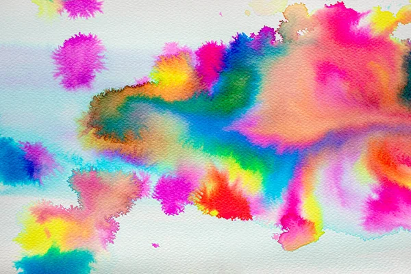 Illustration created with liquid watercolors of the colors of the rainbow on rough watercolor paper