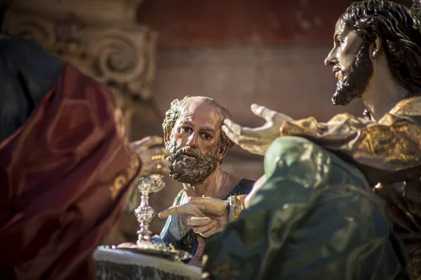 Detail of the sculptural throne of The Last Supper by the sculptor Salzillo in the Good Friday procession in Murcia, Spain in which the face of Saint Peter appears in the foreground