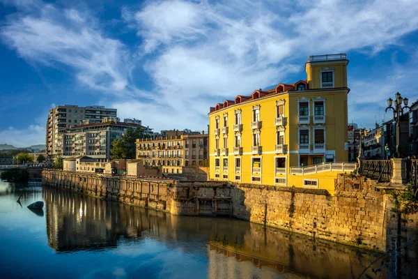 stock image Cityscape of Murcia, Spain, along the Segura river between the Viejo and Los Peligros bridges