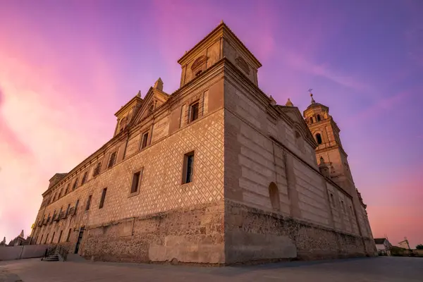Forced perspective view from below of the Jernimos Monastery in Murcia, Spain on a pink dawn