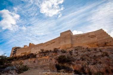 Walls of the castle of Alhama de Murcia, Region of Murcia, Spain, on top of a hill in daylight clipart