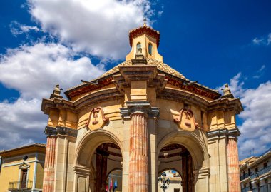 Detailed view of the circular temple with baroque columns in Caravaca, Murcia, Spain with blue sky and clouds clipart