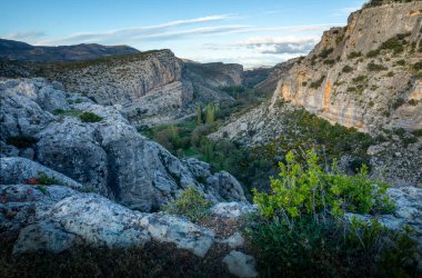 View from Taibilla Castle of the rocky gorge through which the Taibilla River flows in Nerpio, Albacete, Spain, at dawn clipart