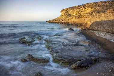 Beautiful cove in the natural regional park of Puntas de Calnegre and Cabo Cope with sunrise light in Region of Murcia, Spain clipart